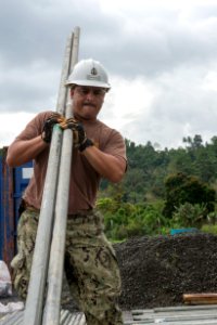 US Navy Seabees and US Air Force RED HORSE engineers build a school in Papua New Guinea during Pacific Partnership 150703-N-UQ938-035