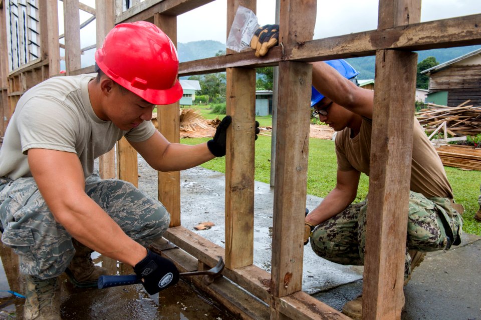 US Navy Seabees and US Air Force RED HORSE engineers build a school in Papua New Guinea during Pacific Partnership 150703-N-UQ938-016
