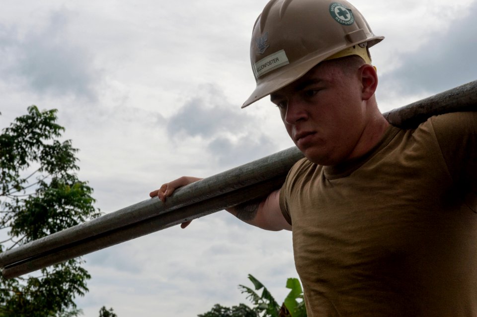 US Navy Seabees and US Air Force RED HORSE engineers build a school in Papua New Guinea during Pacific Partnership 150703-N-UQ938-046