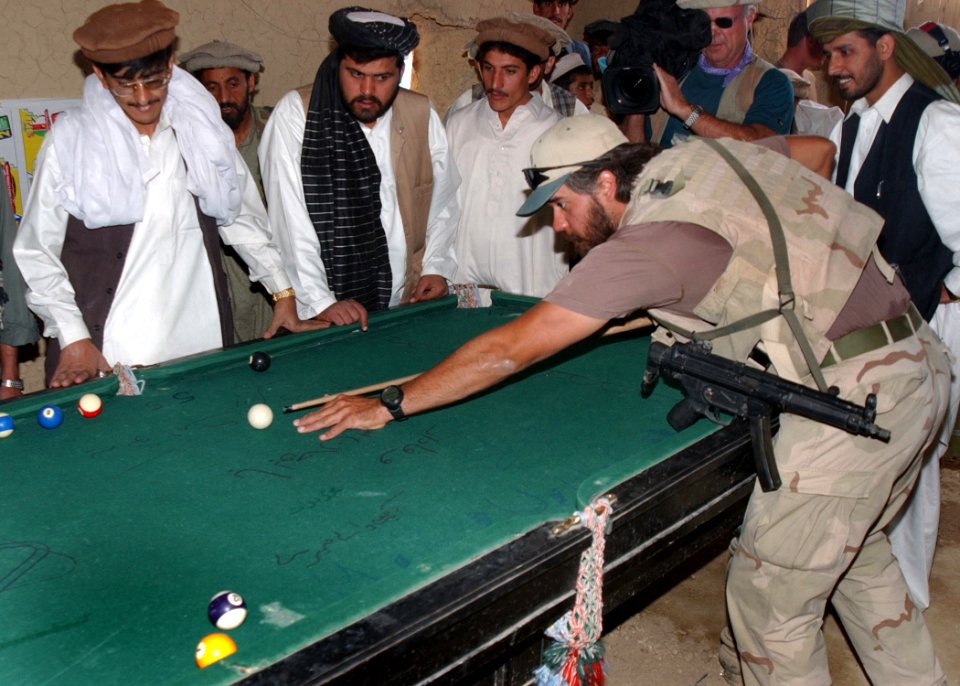US special forces playing pool at a village in Afghanistan