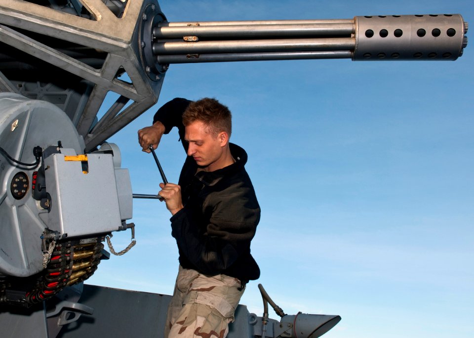 US Navy seaman prepares a CIWS for a live-fire exercise