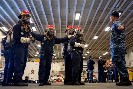 USS Bonhomme Richard (LHD 6) Air Department Sailors Combat Simulated Fire 170224-N-XT039-376