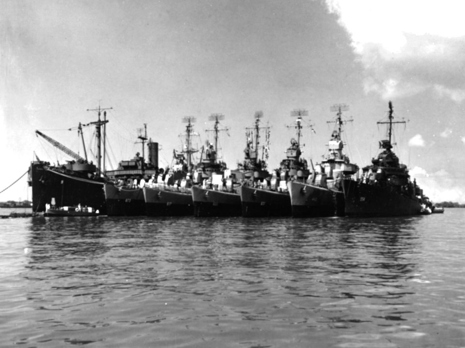USS Black Hawk (AD-9) at anchor at Pearl Harbor with six destroyers, in July 1945 (80-G-354885)