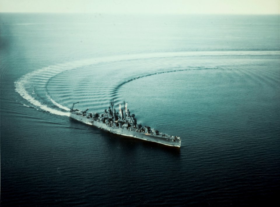 USS Biloxi (CL-80) steams in a turn in October 1943