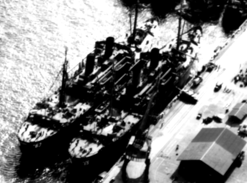 USS Bladen (APA-63) and USS Briscoe (APA-65) docked at the Pearl Harbor Naval Shipyard, Hawaii (USA), 27 February 1946 (80-G-361731)
