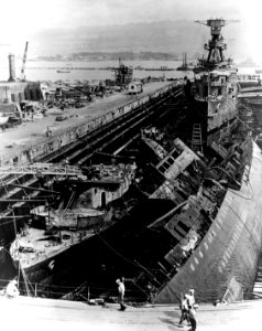 USS Cassin (DD-372), USS Downes (DD-375) and USS Raleigh (CL-7) in dry dock 1 after Perl Harbor attack (NH 54563)