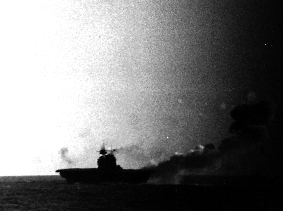 USS Enterprise (CV-6) underway and burning during the Battle of the Eastern Solomons, 24 August 1942 (80-G-288799)