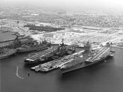 USS Enterprise (CVN-65), USS Coral Sea (CV-43) and USS Oriskany (CV-34) docked at Naval Air Station Alameda on 10 July 1975 (K-109619) photo