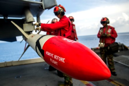 USS George Washington weapons department Sailors mount ordnance to aircraft 141015-N-XK455-095