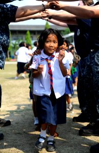 USS Germantown sailors play with children during community service project 120223-N-LP801-244