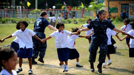 USS Germantown sailors play with children during community service project 120223-N-LP801-170 photo
