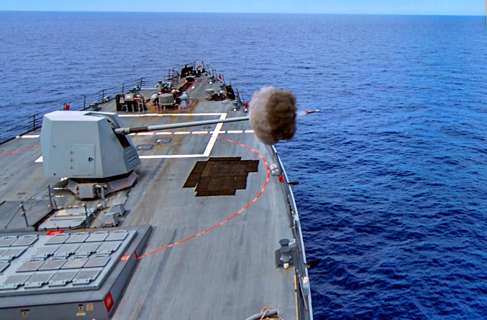 USS Gravely fires its deck gun. (8782325017)