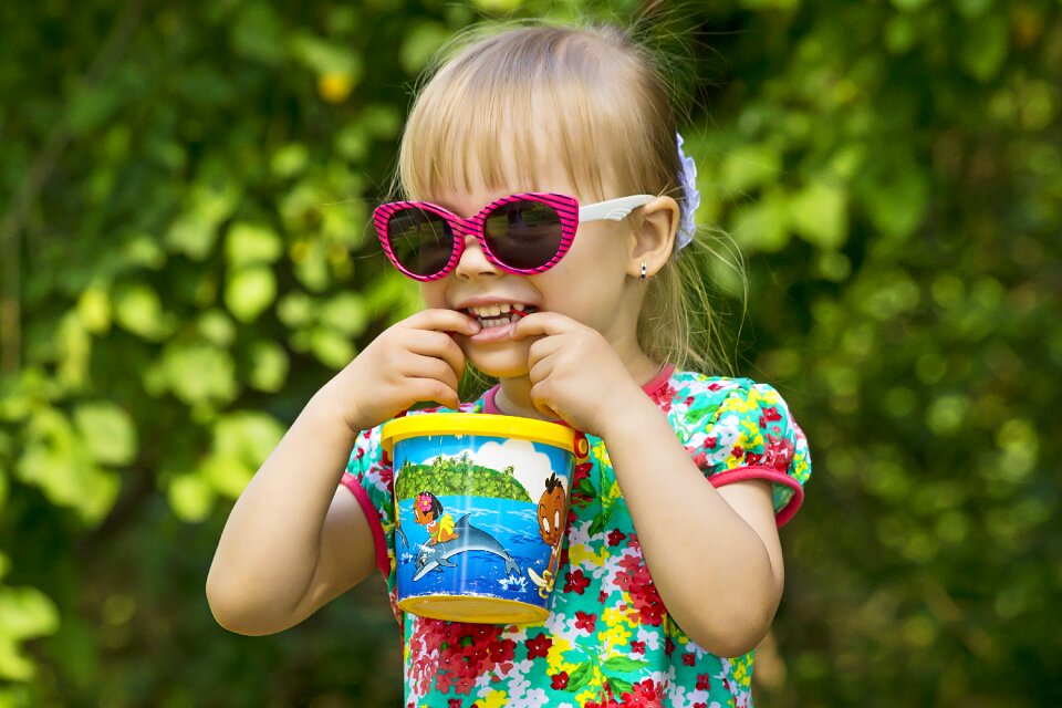 Photographing children sunny day smiling girl