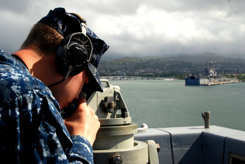 USS Green Bay sailor checks bearings 120924-N-BB534-330