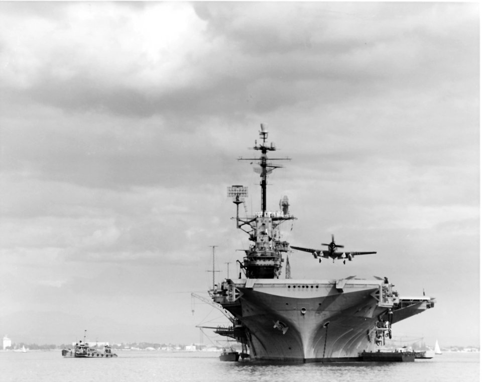 USS Hancock (CVA-19) launches AD-7 Skyraider of VA-115 while at anchor on Manila Bay, in 1961