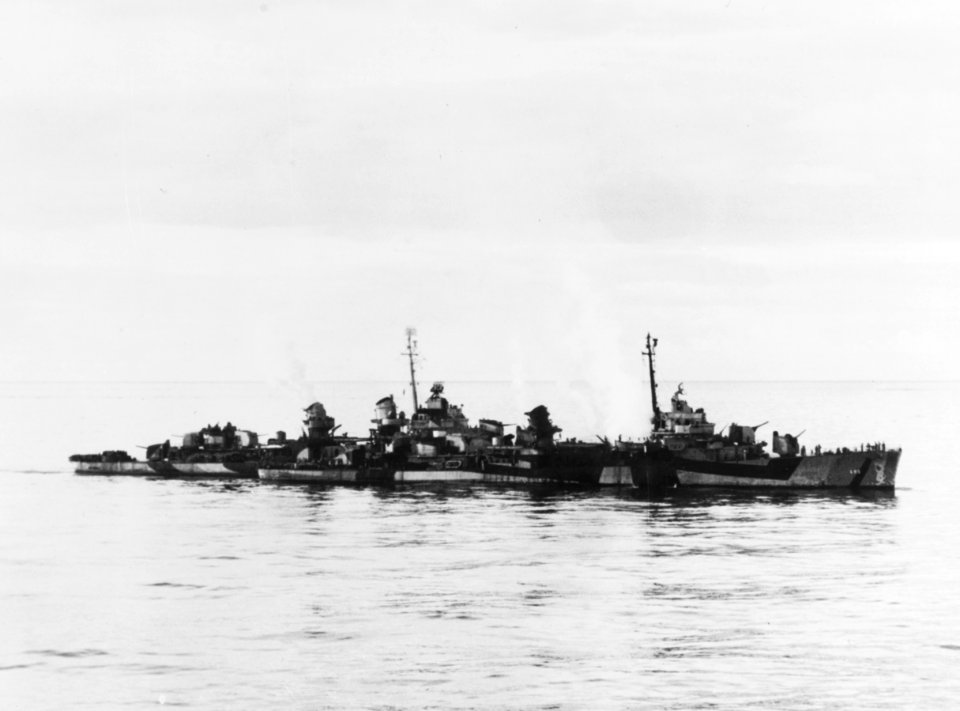 USS Haraden (DD-585) after being hit by a Kamikaze in the Sulu Sea on 13 December 1944 (80-G-273000)