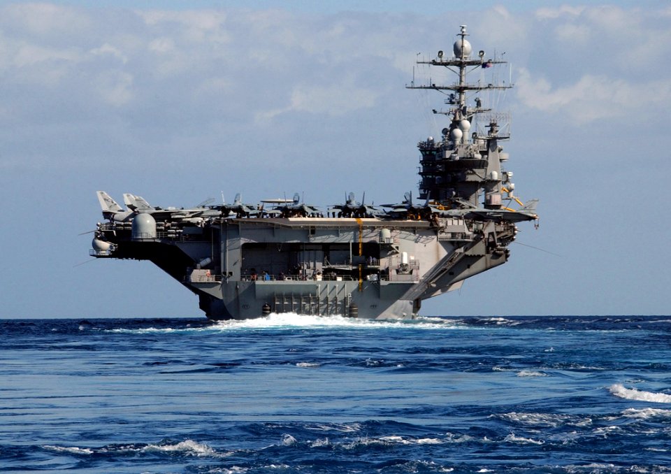 USS Harry S. Truman (CVN 75) sails out of Souda harbor
