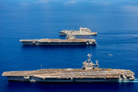 USS Harry S. Truman offloads ammunition to USS George H.W. Bush and USNS Robert E. Peary. (29046377115)