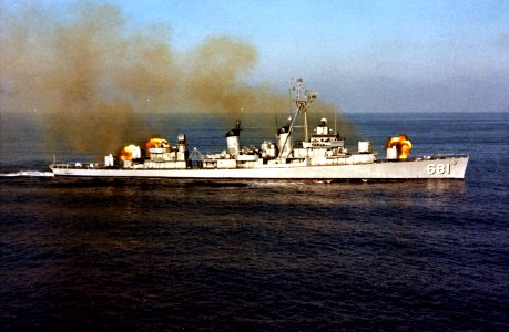 USS Hopewell (DD-681) fires a three-gun salvo, in December 1963 (KN-8731)