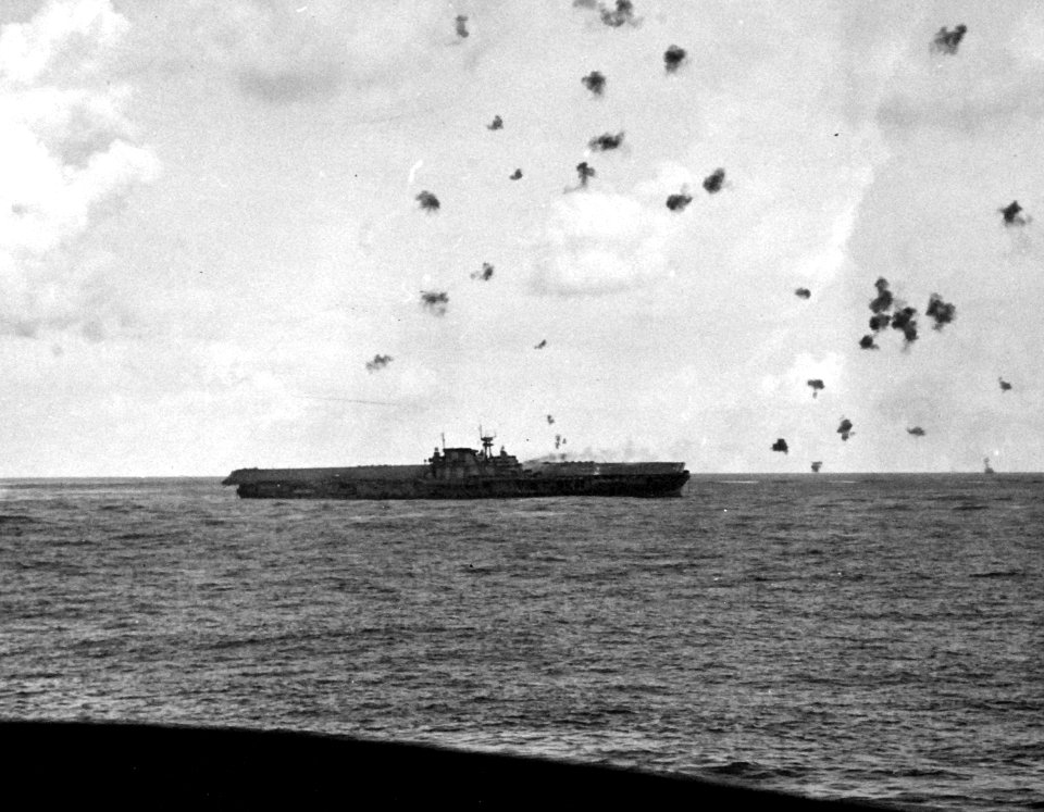 USS Hornet (CV-8) listing after the final the Japanese attack during the Battle of Santa Cruz Islands, 26 October 1942 (80-G-33898)