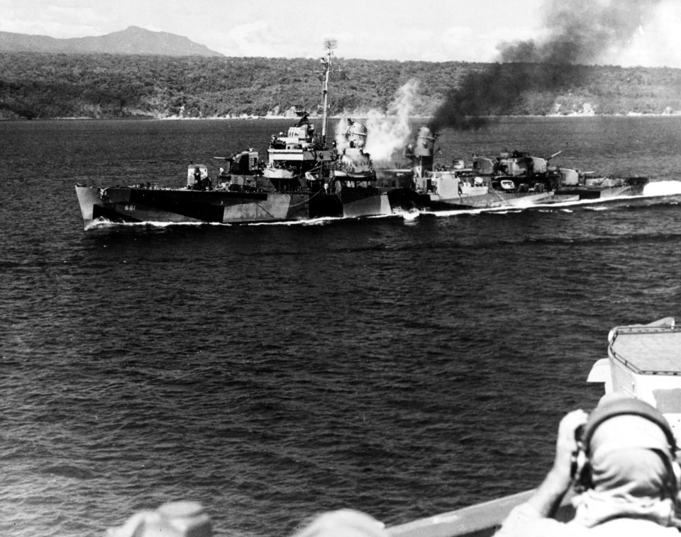USS Hopewell (DD-681) smoking after a hit by a Japanese shore battery off Corregidor, Philippines, on 14 February 1945 (NH 53565)
