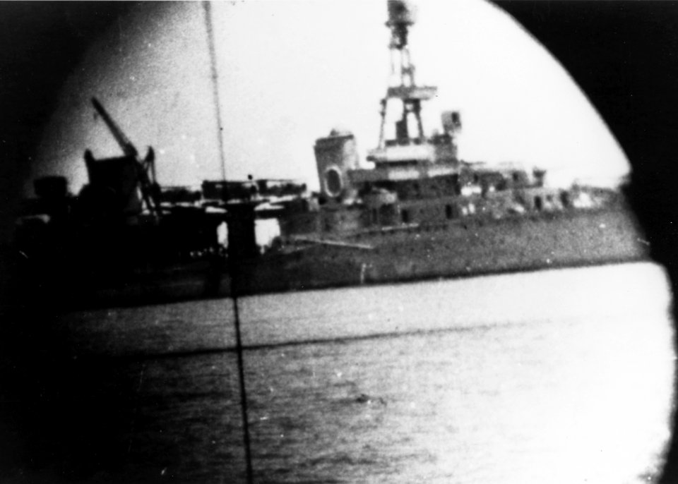USS Houston (CA-30) seen through the sight of an Australian 102 mm gun on 18 February 1942
