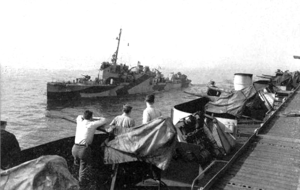 USS Hulbert (DD-342) alongside of USS Takanis Bay (CVE-89), circa in 1945