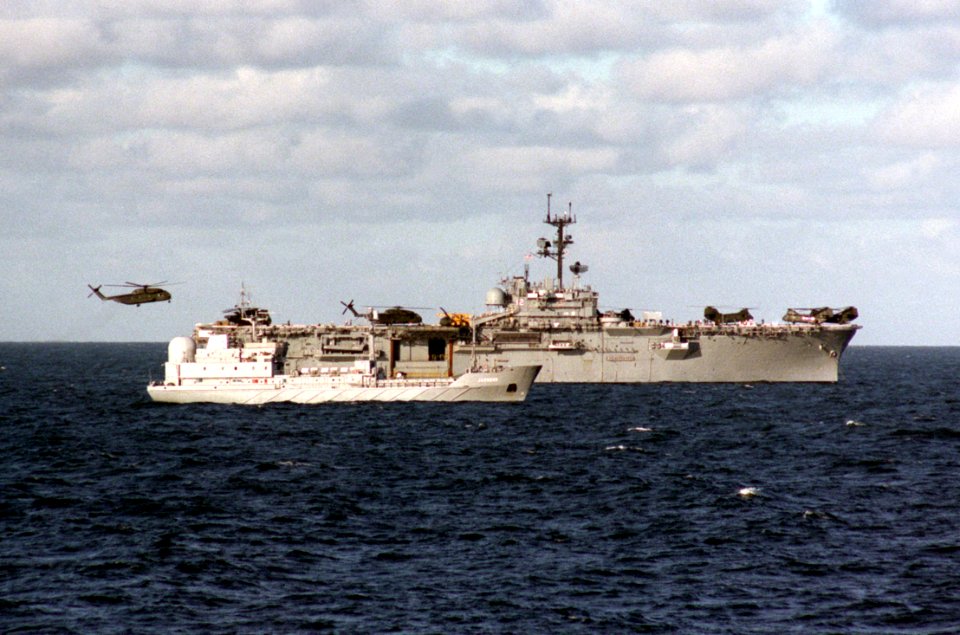 USS Inchon (LPH-12) with East German SIGINT ship Jasmund 1986
