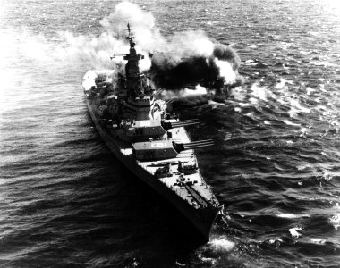 USS Iowa (BB-61) firing her 406 mm guns at North Korean coastal defenses in 1952 photo