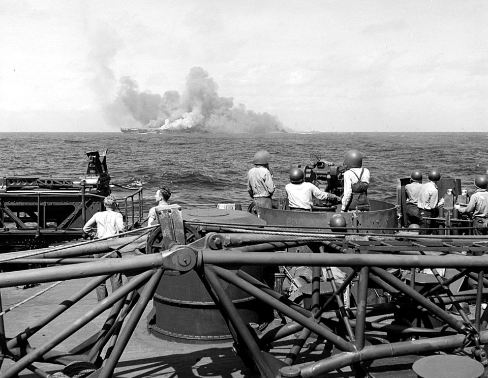 USS Intrepid (CV-11) burning after kamikaze hits, 25 November 1944 (520885)