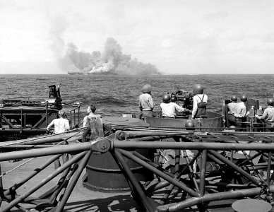USS Intrepid (CV-11) burning after kamikaze hits, 25 November 1944 (520885)