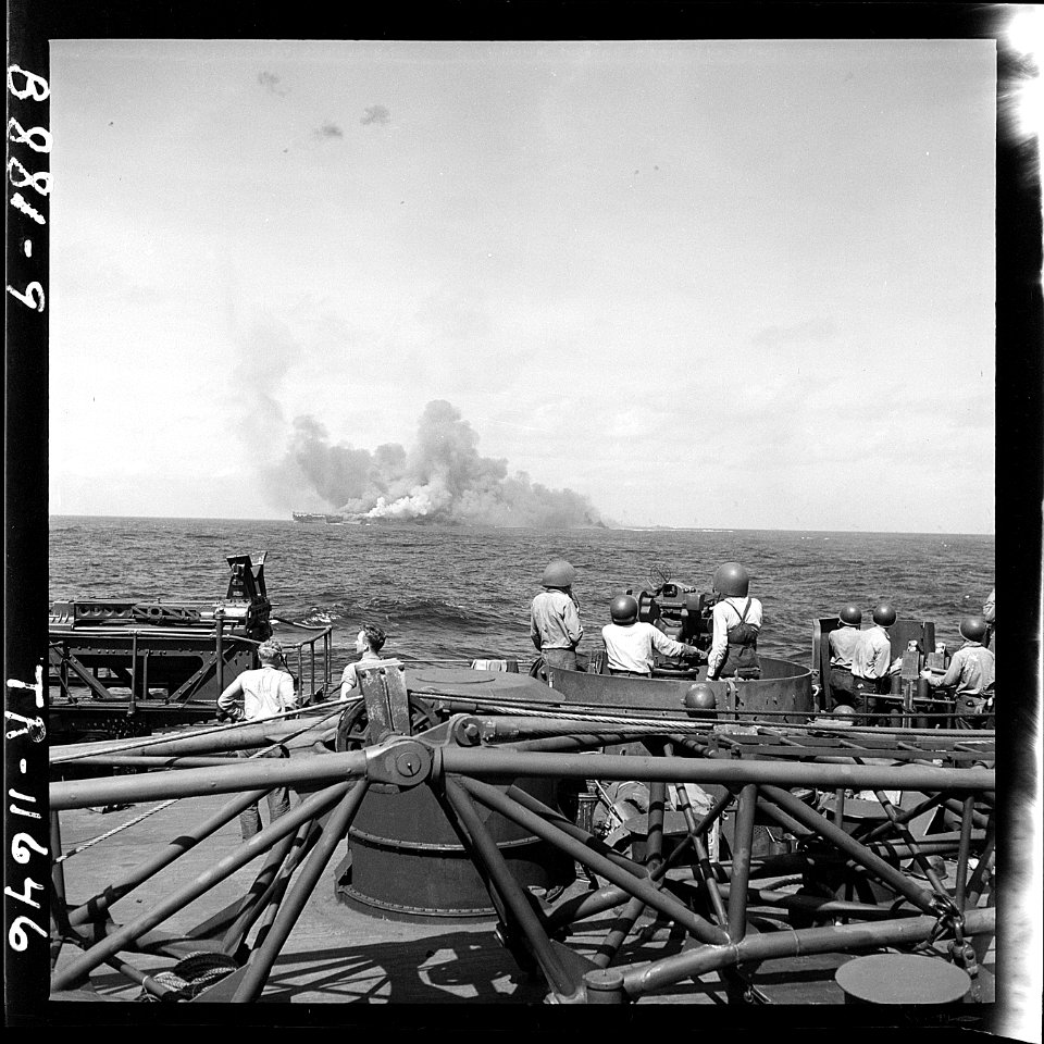 USS Intrepid (CV-11) after being hit by Japanese plane in suicide dive in the Pacific. Taken from USS New Jersey... - NARA - 520885