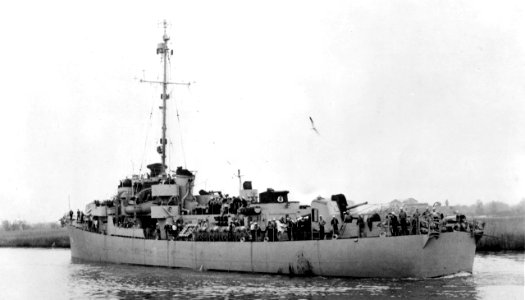 USS John C. Butler (DE-339) being towed by the stern, circa in March 1944 (BS 70488)
