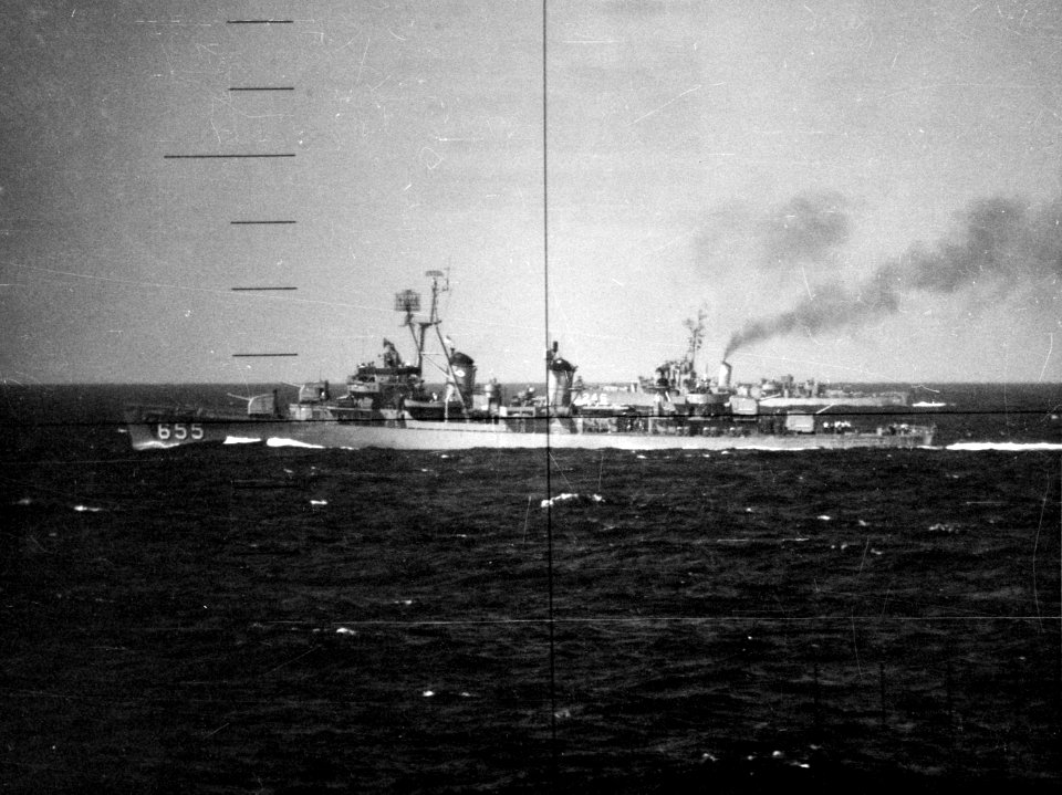 USS John Hood (DD-655) and USS Snowden (DE-246) photographed through a submarine periscope (USN 1042008)