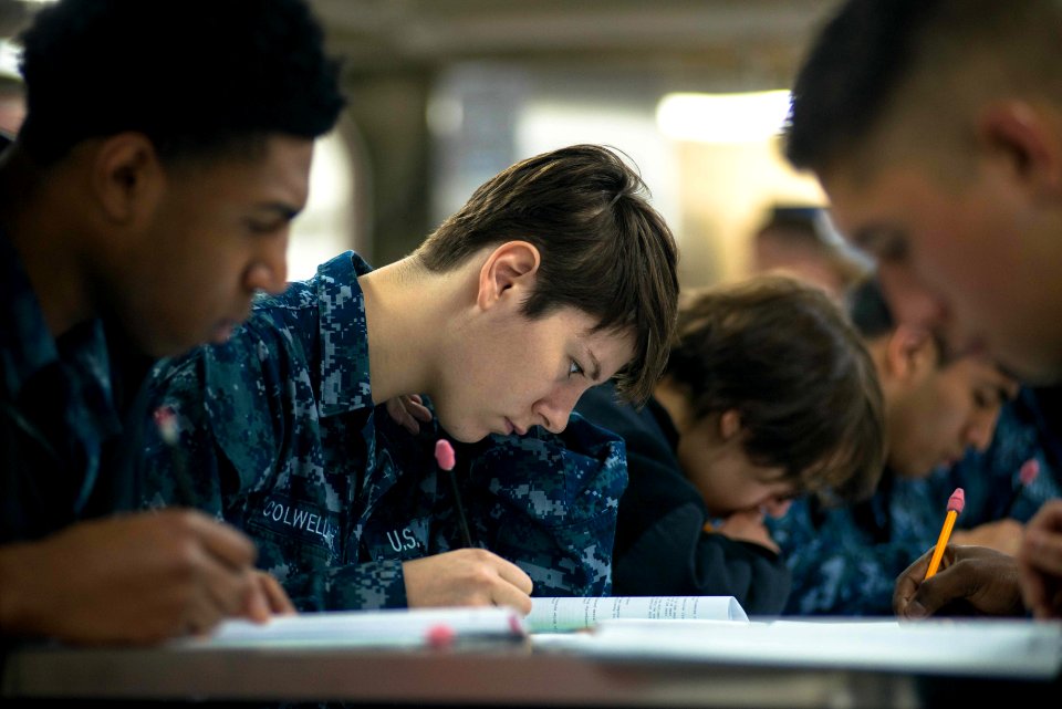USS John C. Stennis Sailors take advancement exam 150917-N-DA737-019