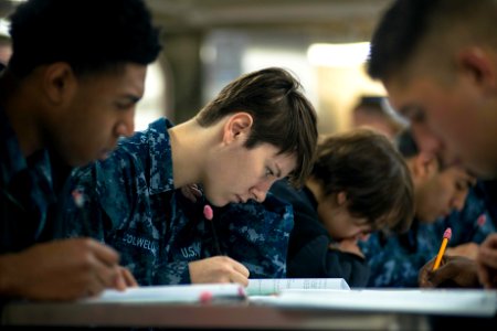 USS John C. Stennis Sailors take advancement exam 150917-N-DA737-019