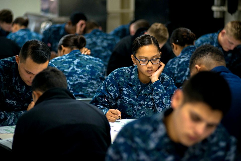 USS John C. Stennis Sailors take advancement exam 150917-N-DA737-030