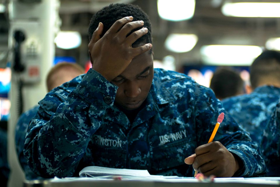 USS John C. Stennis Sailors take advancement exam 150917-N-DA737-027