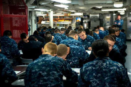 USS John C. Stennis Sailors take advancement exam 150917-N-DA737-015