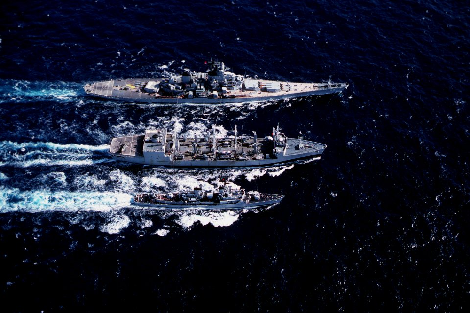 USS Kansas City (AOR-3) replenishes USS New Jersey (BB-62) and USS Buchanan (DDG-14) in the Pacific Ocean on 12 August 1983 (6372764)