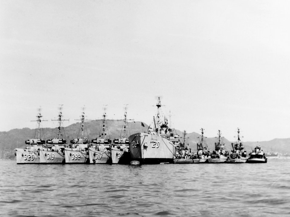 USS Laertes (AR-20) with minesweepers at Sasebo, Japan, on 8 October 1952 (80-G-632291)