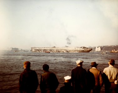 USS Lafayette (AP-53) is tugged down New York Harbor (USA) after being salvaged, circa in September 1943 (80-G-K-3864)