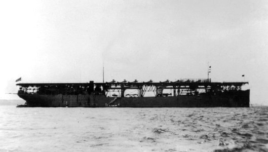USS Langley (CV-1) at anchor, circa in 1923 (NNAM.2001.152.002)