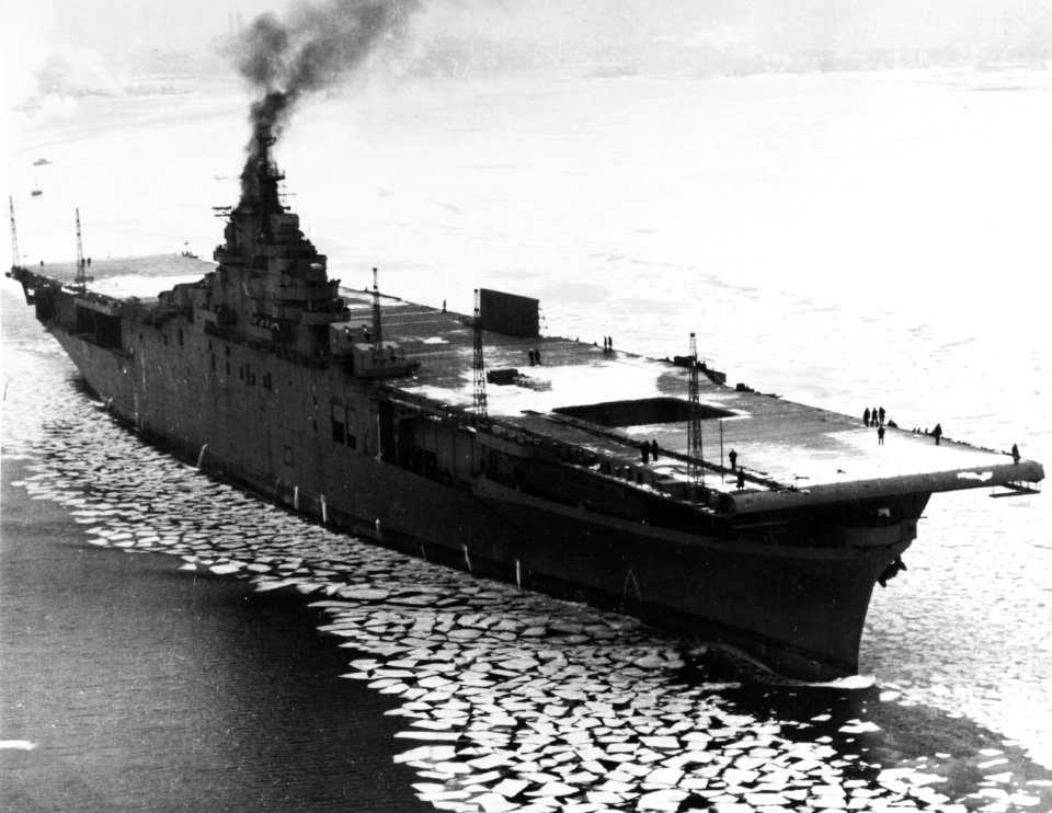 USS Lexington (CV-16) steams through floating ice in Boston Harbor, Massachusetts (USA), on 17 February 1943 (80-G-35657)