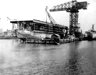 USS Long Island (AVG-1) under conversion at Newport News Shipbuilding, Virginia (USA), on 1 April 1941 (NH 96711)
