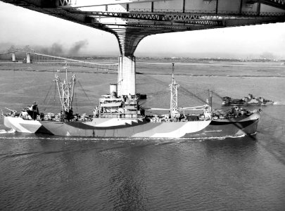 USS Lenoir (AKA-74) passing under the Cooper River bridge, Charleston, South Carolina (USA), circa 6 January 1945 (NH 51275)