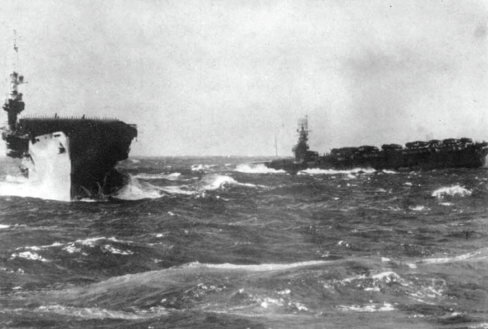 USS Lunga Point (CVE-94) and USS Makin Island (CVE-93) in a Western Pacific storm off Wakayama, Japan, circa 3-7 October 1945