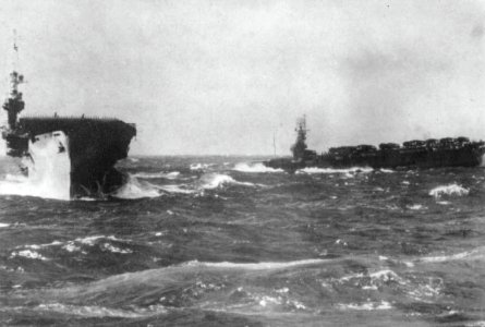 USS Lunga Point (CVE-94) and USS Makin Island (CVE-93) in a Western Pacific storm off Wakayama, Japan, circa 3-7 October 1945