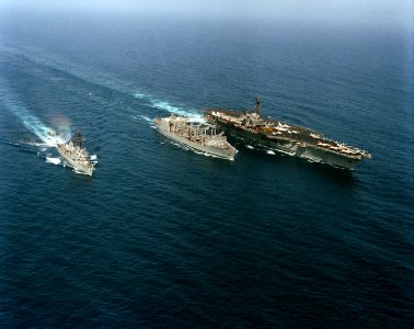 USS Milwaukee (AOR-2) replenishes USS Forrestal (CV-59) and USS Semmes (DDG-18) in June 1988
