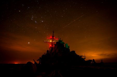 USS Mitscher (DDG 57) lights up its mast during night delayed landing qualifications. (15434479294)
